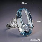 rings-dazzling-blue-zircon-ring-with-side-rhinestone-accents-1.jpg